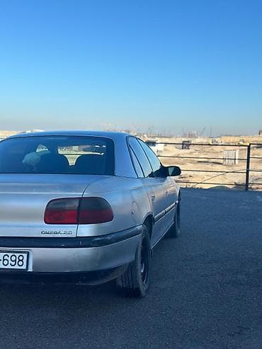 kia optima 2012: Opel Omega: 2 l | 1999 il Sedan — 5