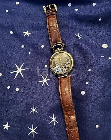 Klassik üslubda mexaniki qol saatı. - Korpus: dairəvi, metal (qızılı — 1