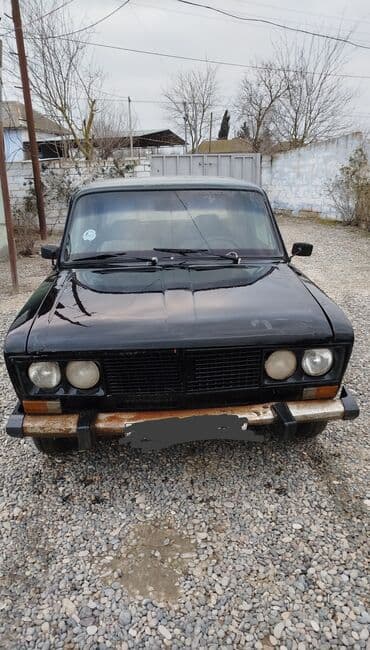 VAZ 2106 sedan Xüsusiyyətlər: - Kuzov: qara rəng, klassik 2106 ön