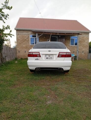 Nissan Sunny: 1.6 л | 2000 г. Седан — 10