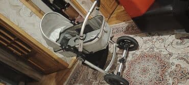 uwaq mawnlari: Çıxarıla bilən beşikli araba — 1