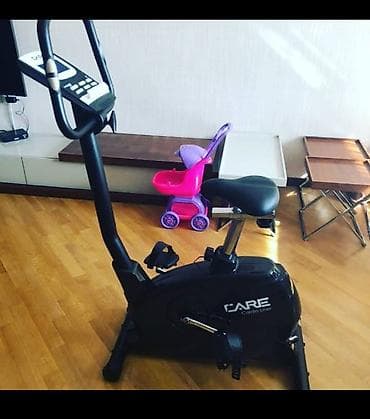 elektrikli mapet: Qara rəngli, “Care” markalı, ayaq pedalları və elektron ekranı olan — 1