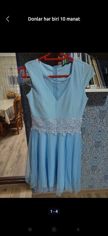 almaniyada saat neçədir: Qadın geyimləri və bir kişi T-shirtü - Qara kişi T-shirtü: üzərində — 5