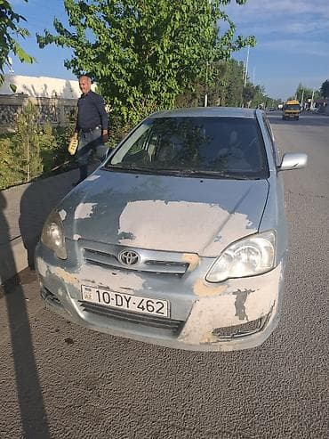 niva satılır: Toyota Corolla hatchback (gümüşü rəng), 5 qapı. - Kuzov: kompakt — 6