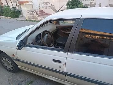 ehtiyat təkəri: Peugeot Pars sedan – ağ rəng, 4 qapı, öndən‑çəkişli. Xüsusiyyətlər: - — 2