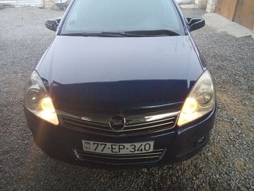 maşın nol altı: Opel Astra Caravan (universal) – tünd göy rəng • Kuzov: 5 qapılı — 1