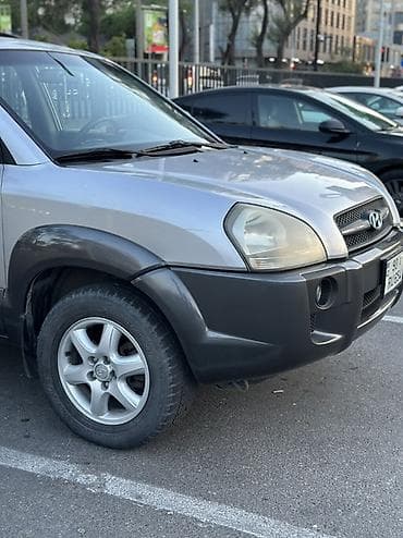 Hyundai Tucson: 2 л | 2005 г. Кроссовер — 7