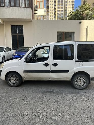 fiad doblo: Fiat Doblo (ağ rəng) – praktik və funksional miniven Xüsusiyyətlər: - — 4