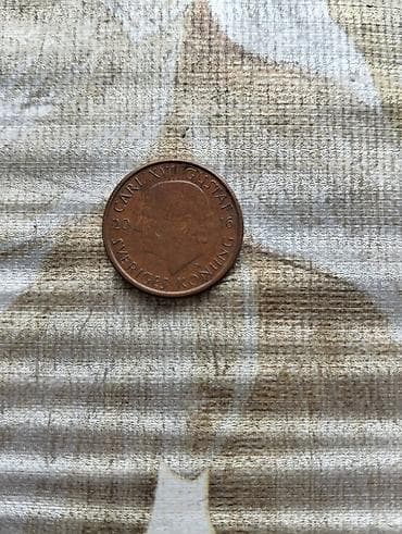 gitara simleri: Məhsul: İsveç 1 krona sikkəsi (2016) Təsvir: - Nominal: 1 krona (EN — 2