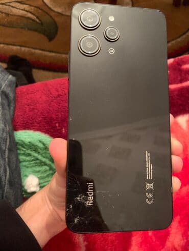 аккумулятор 12: Redmi 12, 256 ГБ, цвет - Черный, Отпечаток пальца — 1