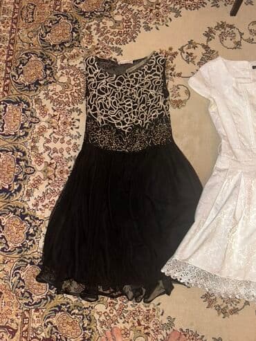 Dəstlər, kostyumlar: Qara rəngdə, yuxarı hissəsi ağ naxışlarla bəzədilmiş ziyafət donu — 1