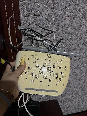 ev modemi: TP-Link TD-W8961N ADSL2+ Wi‑Fi router Xüsusiyyətlər: - Model: TP-Link — 4