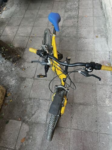 горный велосипед: Sarı rəngli qatlanan şəhər velosipedi Xüsusiyyətlər: - Qatlanma — 3