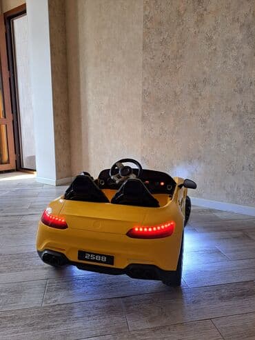 детский мотоцикл каталка: Uşaq üçün elektrikli ride-on avtomobil – sarı rəngdə sport kabriolet — 8