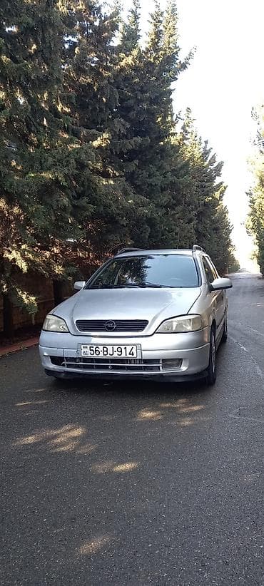 opel astra baqaj: Opel Astra Caravan (universał) – gümüşü rəngli, 5 qapılı ailə və — 4