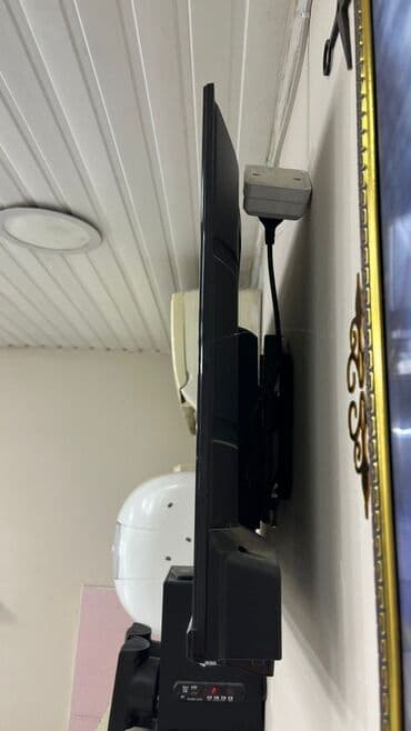 regular tv: Hauser Smart TV – divara quraşdırılmış, nazik çərçivəli ekran — 2