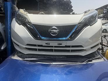 Транспорт: Nissan Note üçün ön hissə komplekti. Komplektə görünən əsas detallar — 2