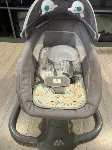 dinozavr yumşaq oyuncaqlar: Uşaqlar üçün nəzərdə tutulmuş, boz rəngli, yellənən beşik. Beşikdə — 2