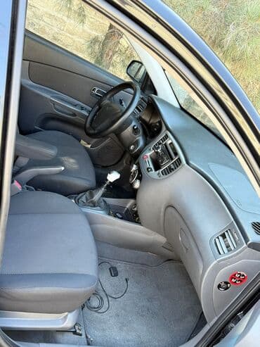 çaşqa feredo: Kia Rio: 1.4 л | 2006 г. Хэтчбэк — 5