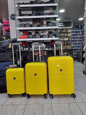 Çamadanlar: Məhsul: Sarı rəngli 3-lü səyahət çamadan dəsti Xüsusiyyətlər: - 3 — 1