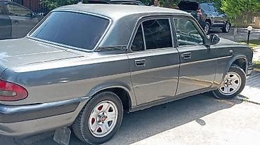 qara disk: GAZ Volga 31105 sedan - Kuzov: 4 qapılı sedan, tünd boz rəng, xrom ön — 8