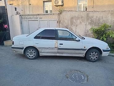 ehtiyat təkəri: Peugeot Pars sedan – ağ rəng, 4 qapı, öndən‑çəkişli. Xüsusiyyətlər: - — 1