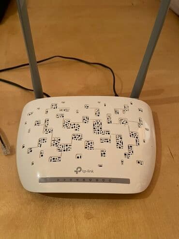 saz modem satilir: TP-Link tərəfindən hazırlanmış, iki anteni olan ağ rəngli simsiz — 1