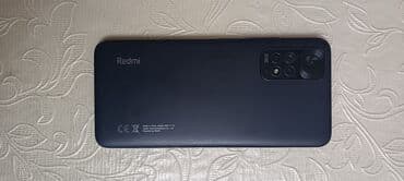 Honor: Xiaomi Redmi smartfon - Model: Redmi (arxa qapaqda “Model: 2201117TG” — 2