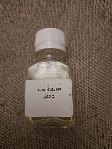 Gucci Guilty MG – ətir esansı - Şüşə flakon, ağ vintli qapaq - Etiket