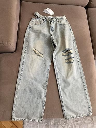 Açıq mavi yuyulmuş effektli, geniş kəsimli cins şalvar. - Model — 2