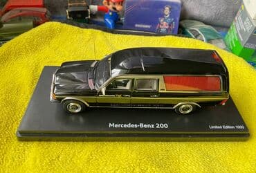 metbex tavan modelleri: Коллекционная модель Mercedes-Benz 200 W123 Hearse black 1982 Schuco — 1