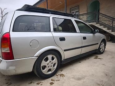 kia optima 2013: Opel Astra Caravan (universal) – gümüş rəngli kuzov, 5 qapı, dam — 2