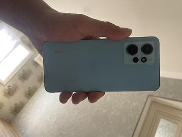 telefon bakı: Xiaomi Redmi note12 smartfon - Model: Redmi (mavi rəngli korpus, arxa — 2