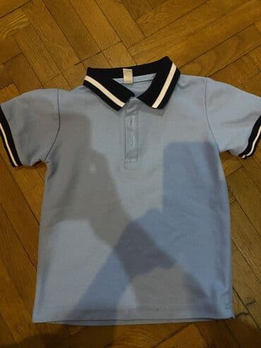 фольксваген поло замена: Uşaq üçün polo köynək – açıq mavi rəngdə, yaxası və manjetləri tünd — 1