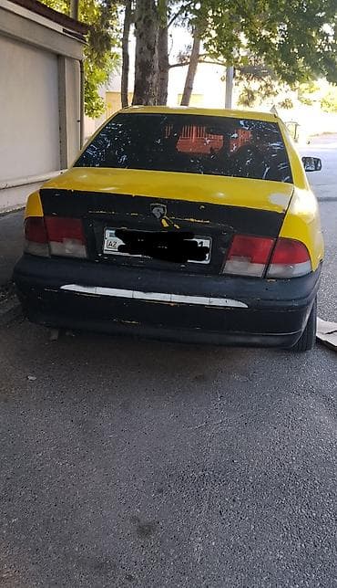 turbo az qaz 21: Model: Iran Khodro Samand (sedan) Kuzov: 4 qapı, sarı/qara rəng sxemi — 5
