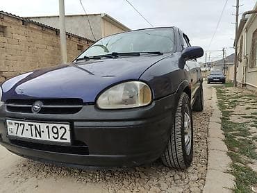 teker 14: Opel Corsa B, 5 qapı, tünd bənövşəyi rəngli hetçbek. Xüsusiyyətlər: - — 3