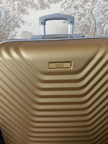 LODE brendinin qızılı rəngdə sərt korpuslu səyahət çamadanı L razmer — 3