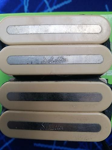 Schaller elektrik gitara pikapları – rail tipli, krem rəngli korpusda