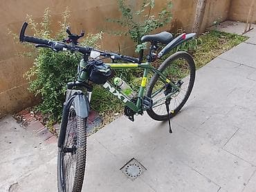 velosiped kameri: MTB tipli şəhər/dağ velosipedi – yaşıl gövdə, NX7 brend işarələri — 1