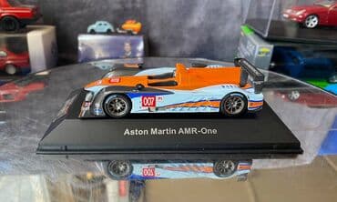где можно продать марки: Коллекционная модель Aston Martin AMR-One #7 Gulf Team LeMans 2011 — 10