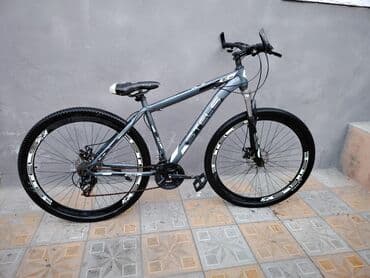 qalin tekerli velosiped: STELS markalı dağ velosipedi, boza çalan gövdə rəngi ilə fərqlənir — 2