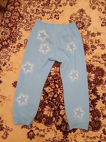 Məhsul: Mavi rəngli idman şalvarı - Dizayn: Ön və arxa hissədə