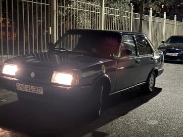 taksi maşınları: Model: Tofas Şahin/Doğan sedan (mavi rəng) Kuzov: 4 qapılı, klassik — 2