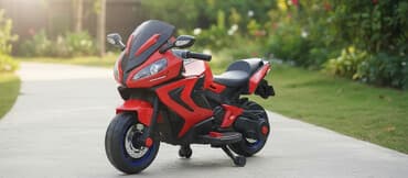 Qırmızı və qara rənglərdə olan uşaq elektrik motosikleti. Uşaqların