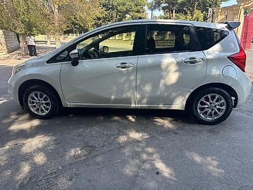 nisan note: Nissan Note – ağ rəngli, 5 qapılı kompakt hetçbek. Nissan Note 2015 — 3