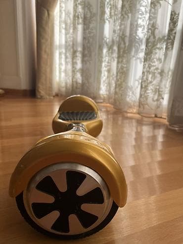 Elektrik nəqliyyatı: Qızılı rəngdə hoverboard (özünü tarazlayan skuter) Bele istemir amma — 3