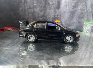 maşın modeli: Коллекционная модель Mitsubishi Lancer Evolution VII black 2002 — 6