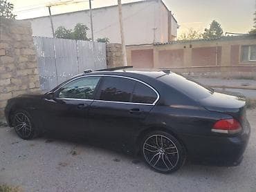 bmw e39 radiator: BMW 7 Series (E65) sedan – qara rəngdə, arxa ötürməli lüks biznes — 1