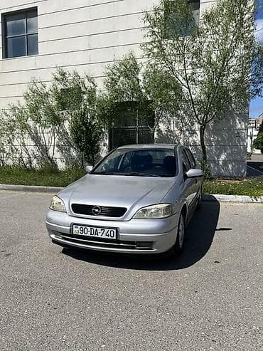 Opel: Opel Astra G hatchback – gümüşü rəng, 5 qapı, 5 yerlik salon. Texniki — 2