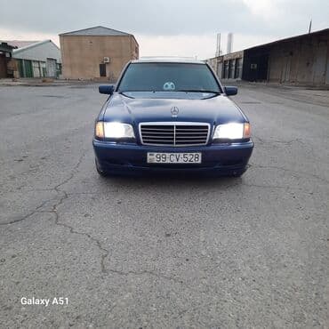 Mercedes-Benz C‑Class sedan, mavi gövdə rəngi. 4 qapılı, tünd şüşələr lalafo.az -da Mercedes-Benz C‑Class sedan, mavi gövdə rəngi. 4 qapılı, tünd şüşələr